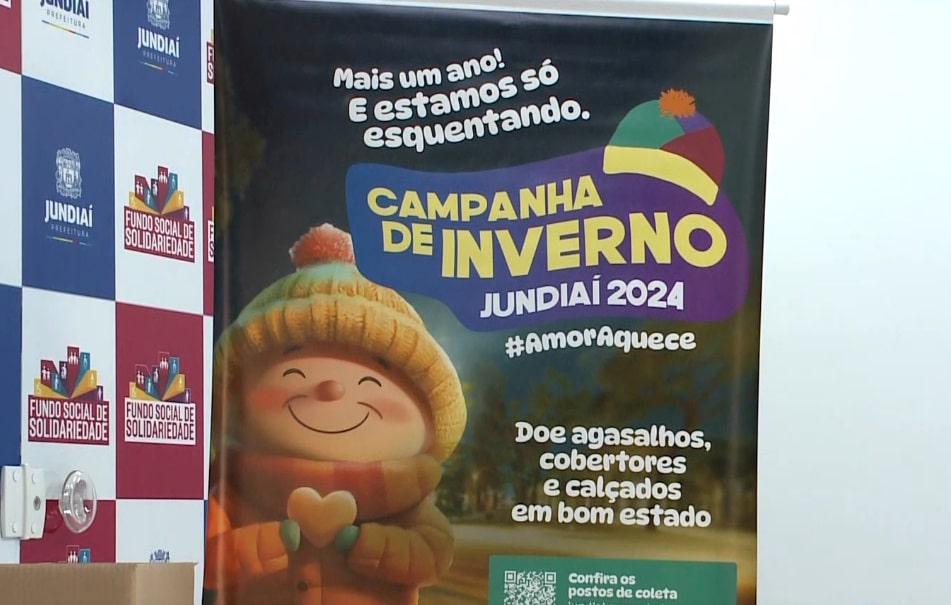 Imagem de banner físico da campanha do agasalho.