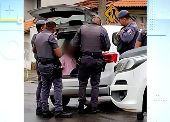 Policiais prendendo suspeito.